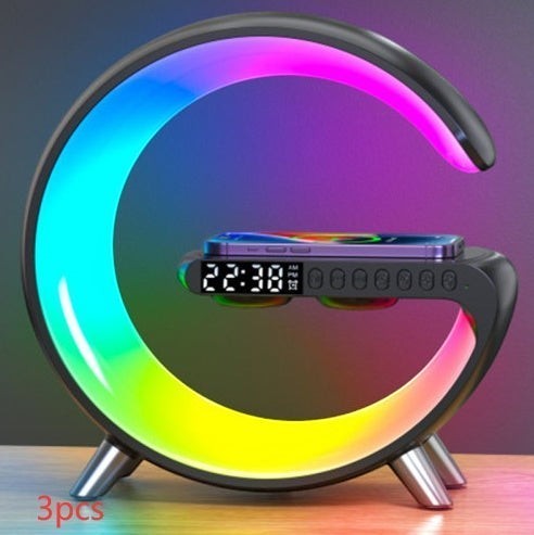 DRAVEQ G-shape atmosphere lamp with RGB lighting, wireless phone charger, digital clock, and built-in Bluetooth speaker.